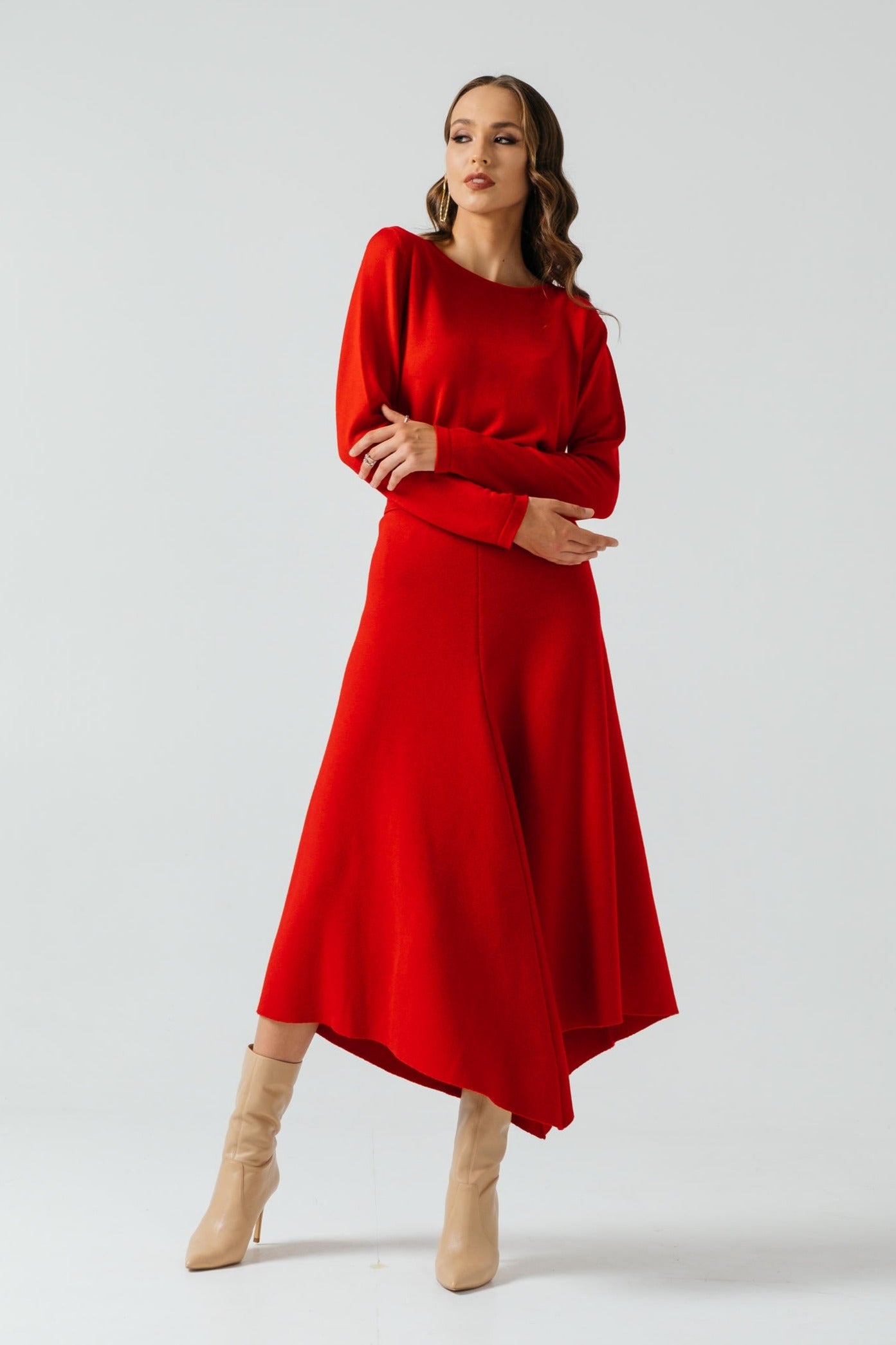 Woman wearing a red outfit with a white background